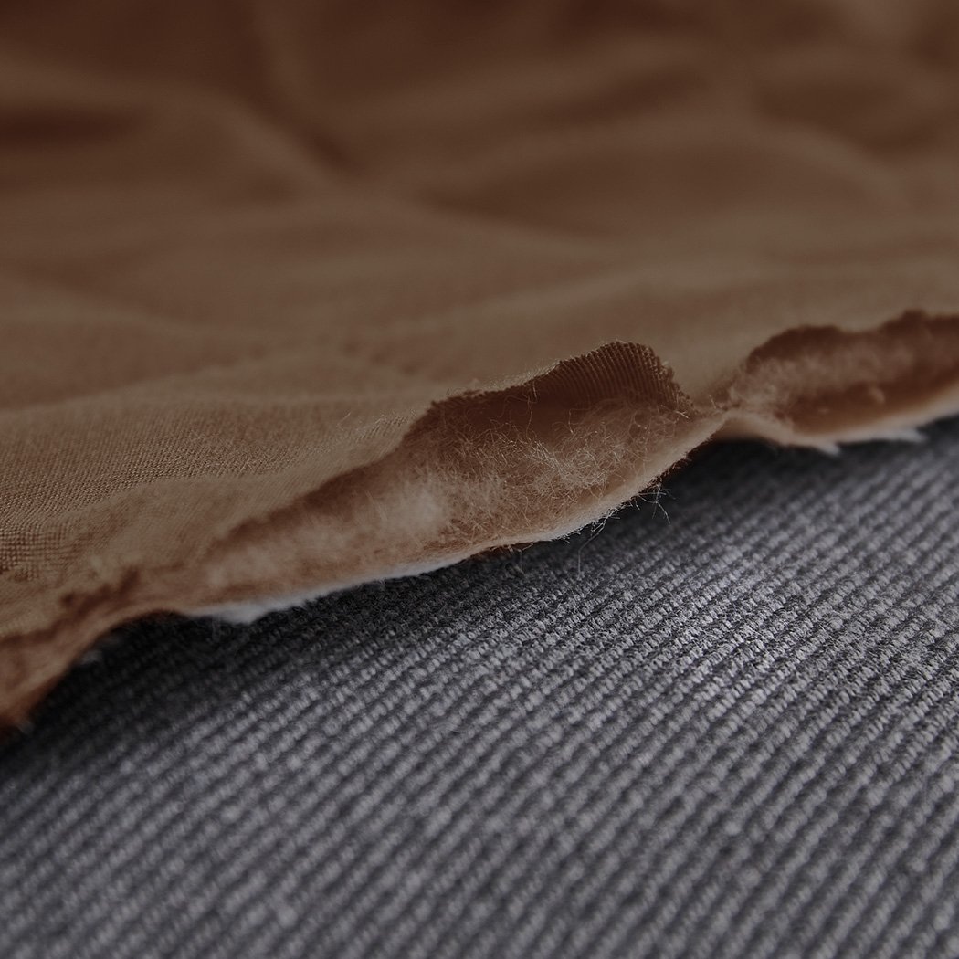 Brown quilted 2 seater sofa cover with microfiber filling, showcasing its anti-slip base and well-stitched edges.