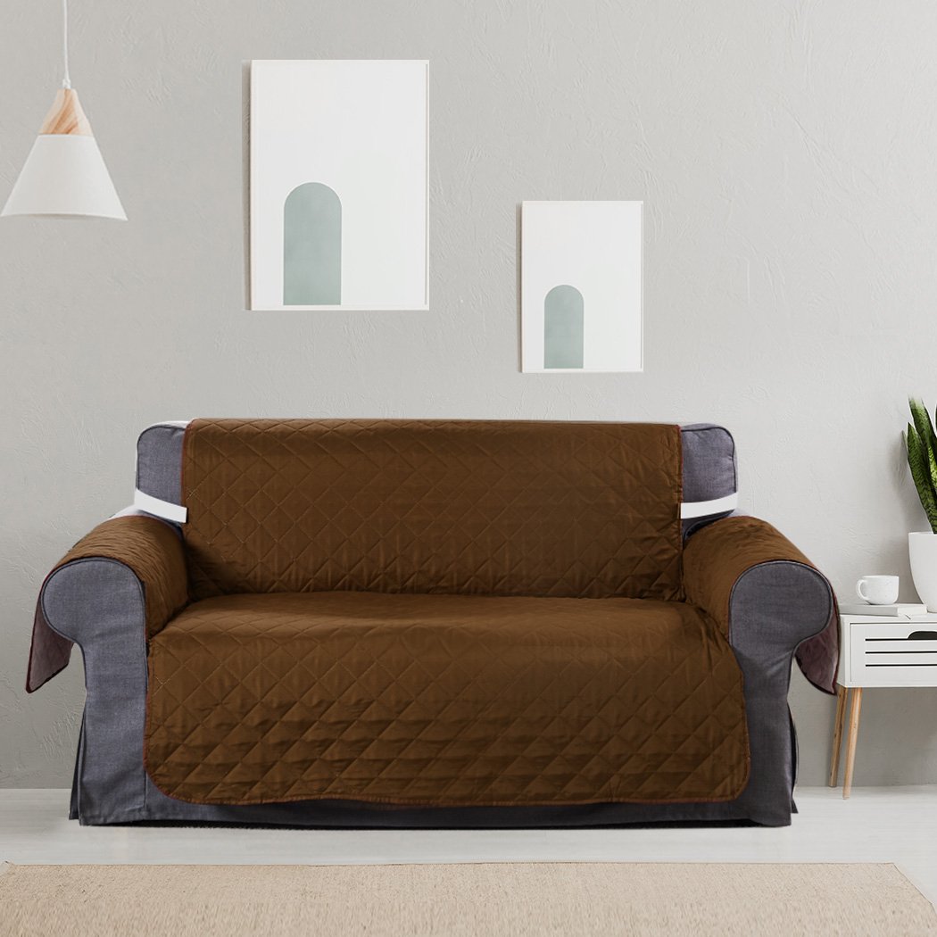 Brown quilted 2 seater sofa cover with microfiber filling, showcasing its anti-slip base and well-stitched edges.
