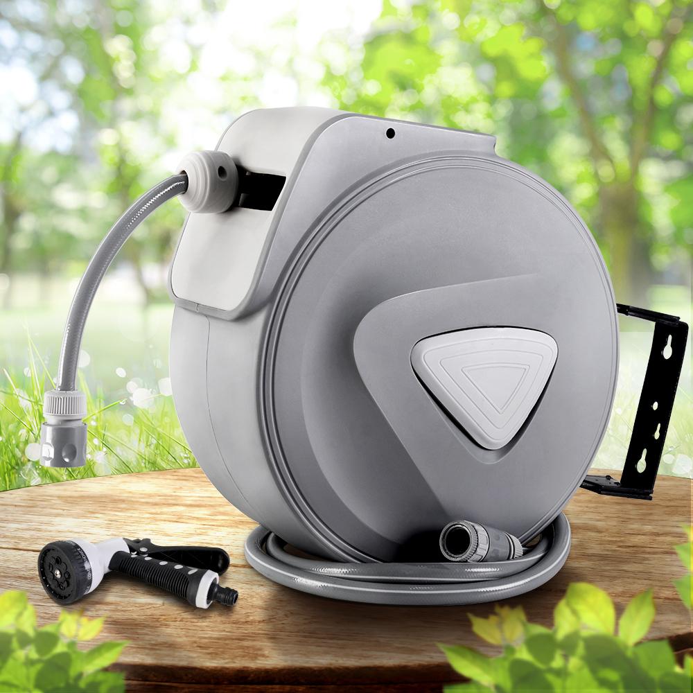 20M Retractable Water Hose Reel with a grey finish, wall-mounted, featuring a spray gun with nine adjustable settings.
