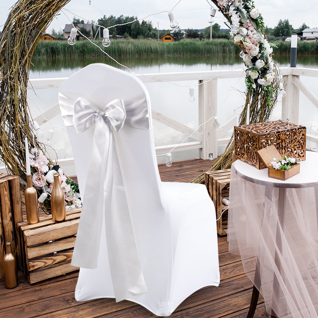 20 satin chair sashes in various colors elegantly draped over chairs, perfect for weddings and events.