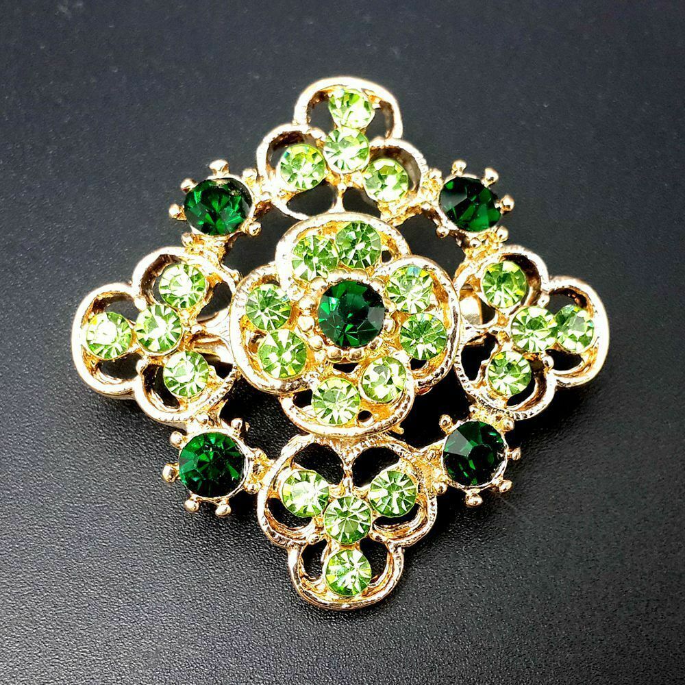 A collection of 24 vintage-style brooches featuring mixed alloy and rhinestone crystals, showcasing various floral designs.