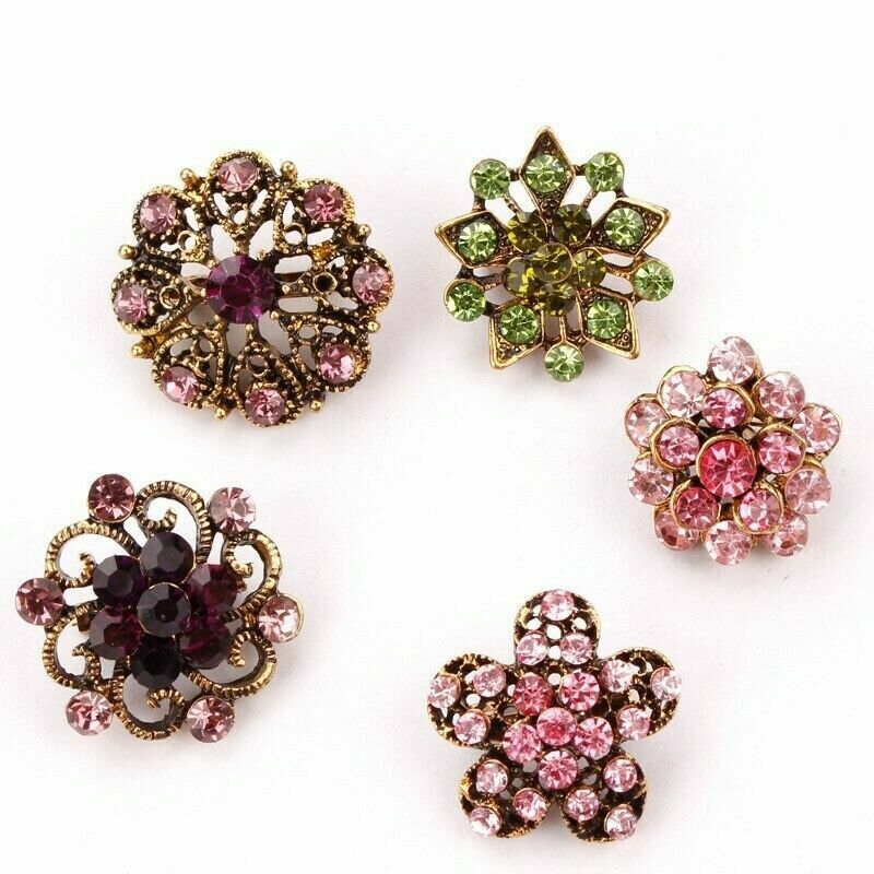 A collection of 24 vintage-style brooches featuring mixed alloy and rhinestone crystals, showcasing various floral designs.