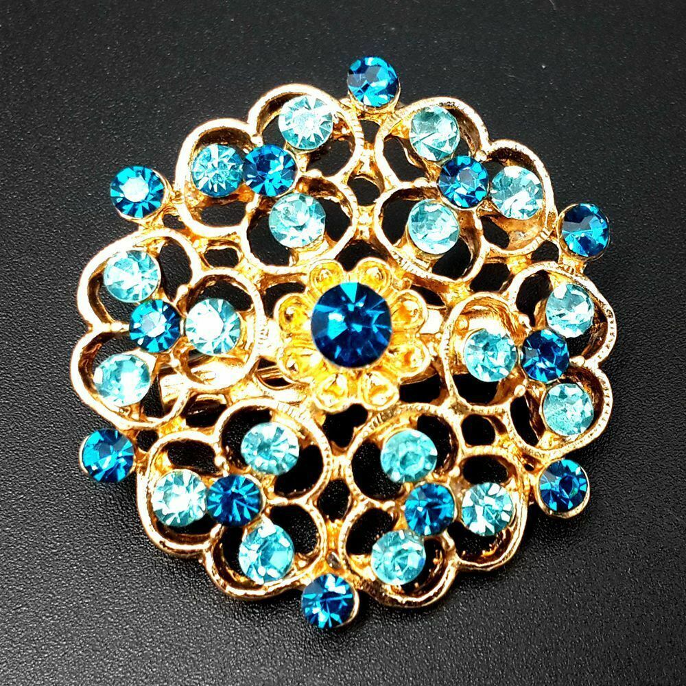 A collection of 24 vintage-style brooches featuring mixed alloy and rhinestone crystals, showcasing various floral designs.