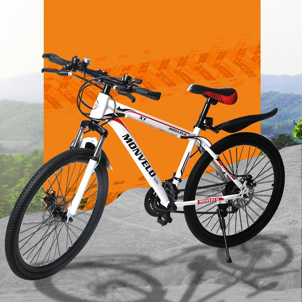 A sleek 26'' Mountain Bike with a carbon steel frame, 21-speed gear system, and dual disc brakes, showcasing its ergonomic saddle and stylish design.