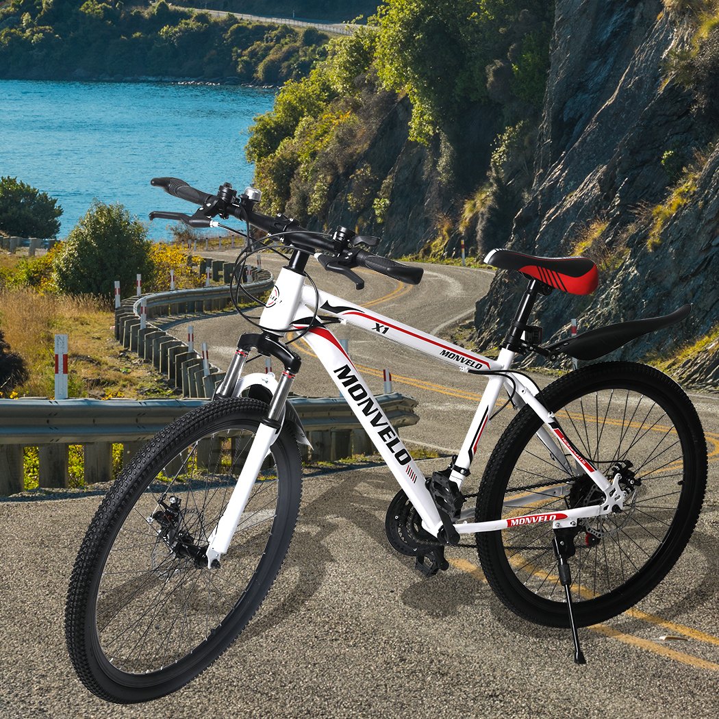 A sleek 26'' Mountain Bike with a carbon steel frame, 21-speed gear system, and dual disc brakes, showcasing its ergonomic saddle and stylish design.