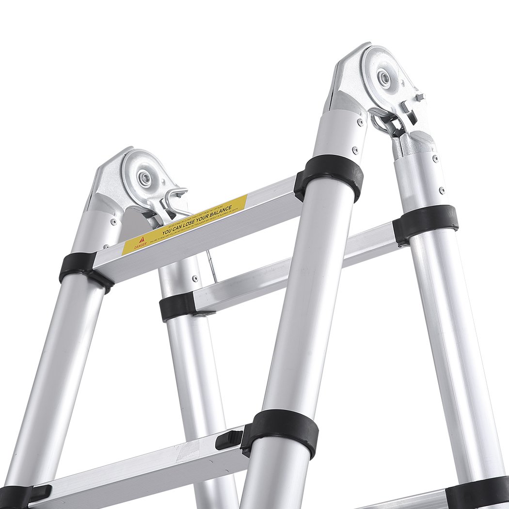 2M Telescopic Aluminium Multipurpose Ladder with anti-skid footboard and rubber-tipped feet, showcasing its extendable design.