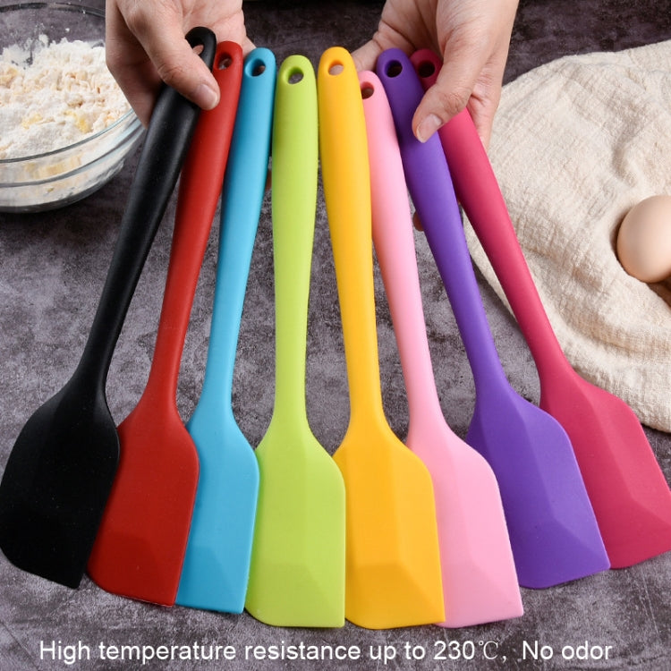 Two large integrated silicone scrapers with rounded handles, ideal for mixing chocolate and cream in the kitchen.