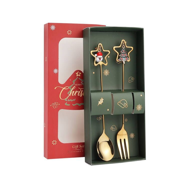 A set of two A410 stainless steel Christmas stirring spoons with festive designs, elegantly packaged in a gift box.
