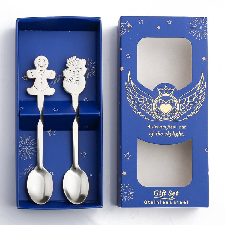 A festive 2pcs stainless steel spoon set featuring Christmas-themed designs including snowmen and gingerbread, perfect for holiday dining.