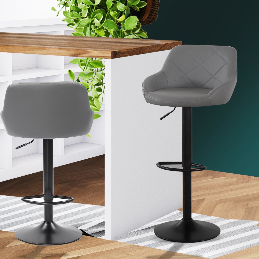 Set of two stylish bar stools with swivel seats, upholstered in premium grey PU leather, featuring a sturdy steel frame and adjustable height.