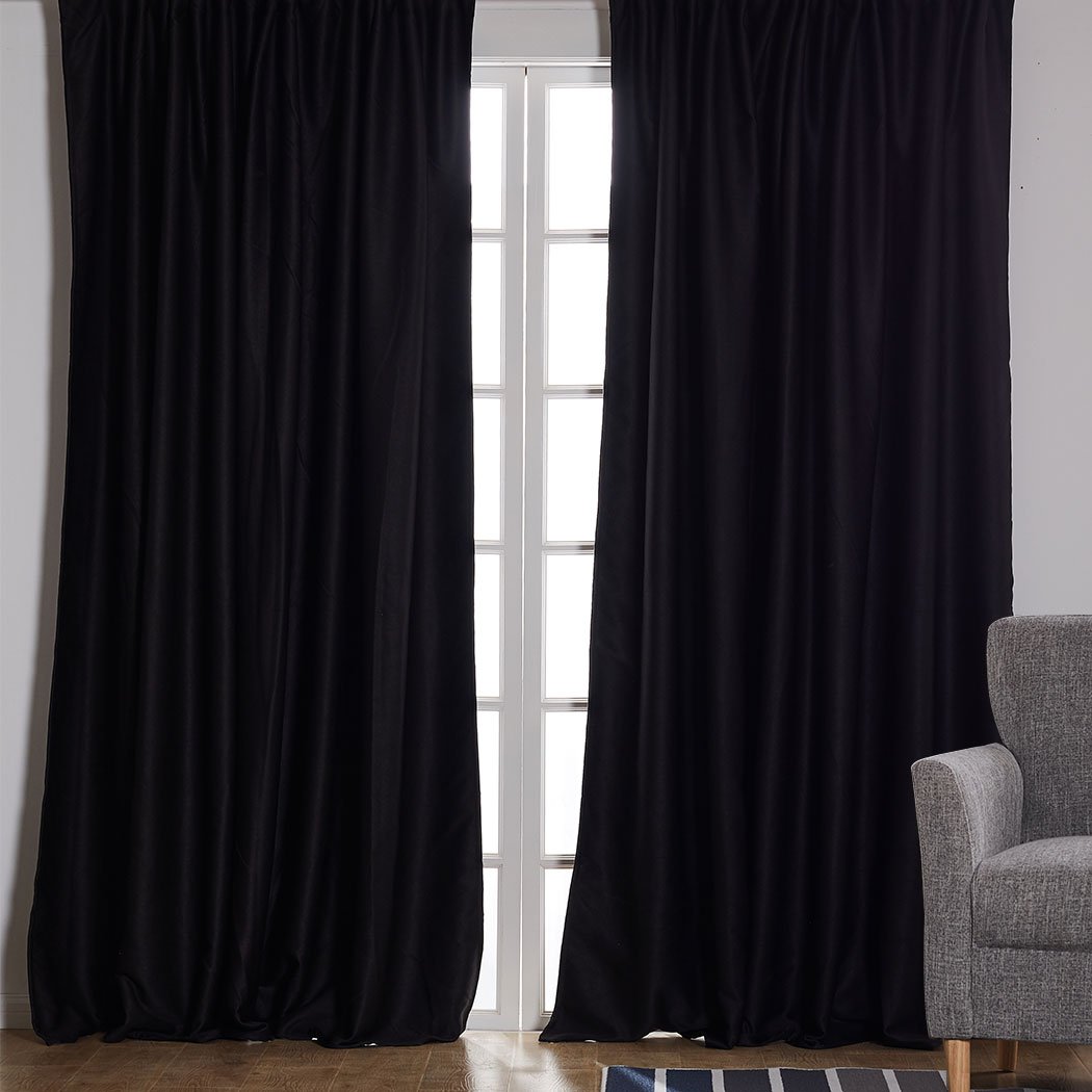 Elegant black 2X blockout curtains designed to block sunlight and noise, perfect for bedrooms and living spaces.