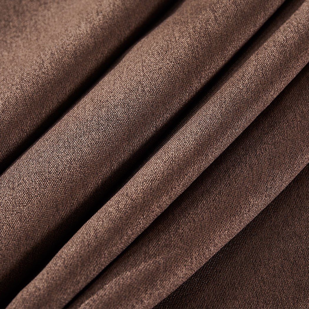 Elegant stone-colored 2X blockout curtains hanging in a stylish bedroom, showcasing their premium quality and design.