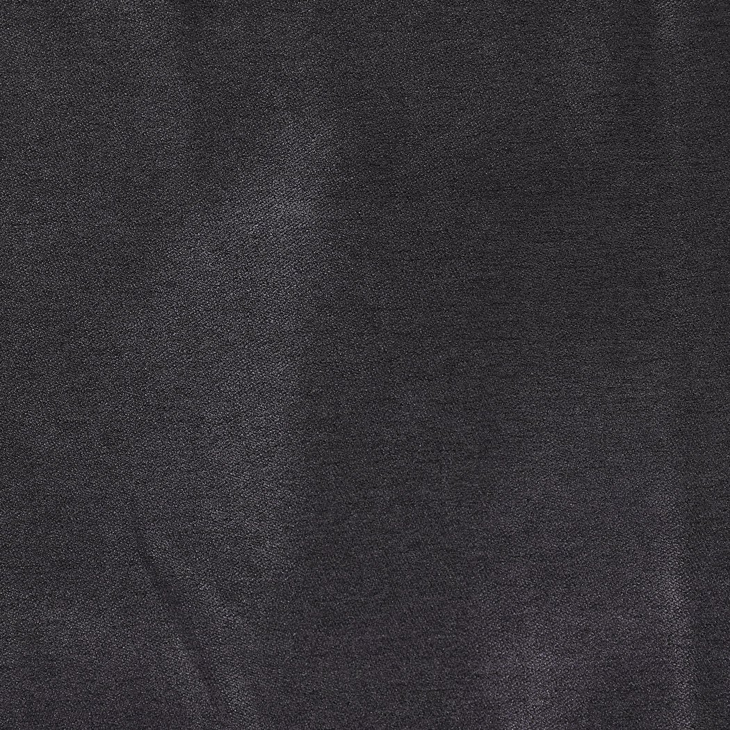 Two dark grey blockout curtains hanging elegantly in a bedroom, showcasing their premium quality and stylish design.