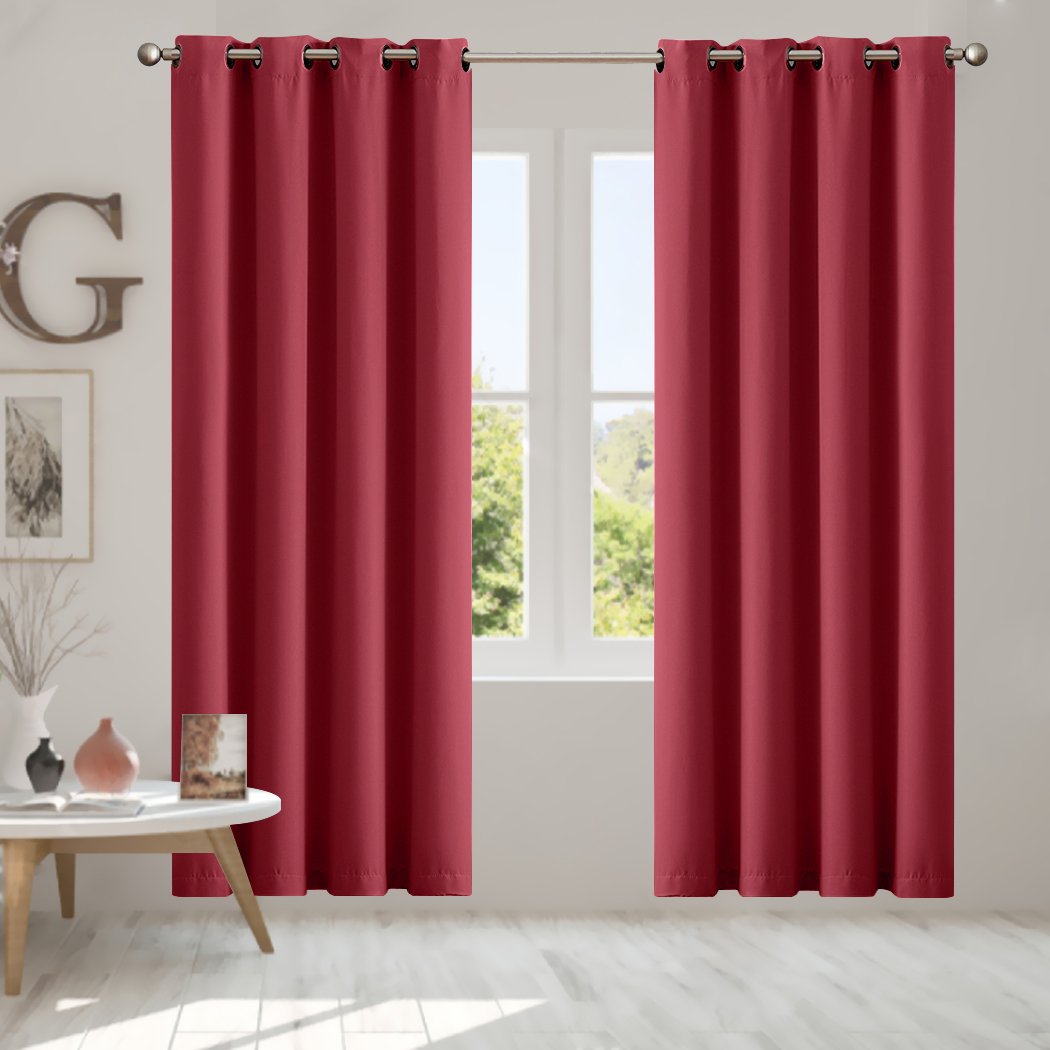 Elegant 2x Blockout Curtains Panels in vibrant color, featuring eyelet design and triple weave fabric for effective room darkening.