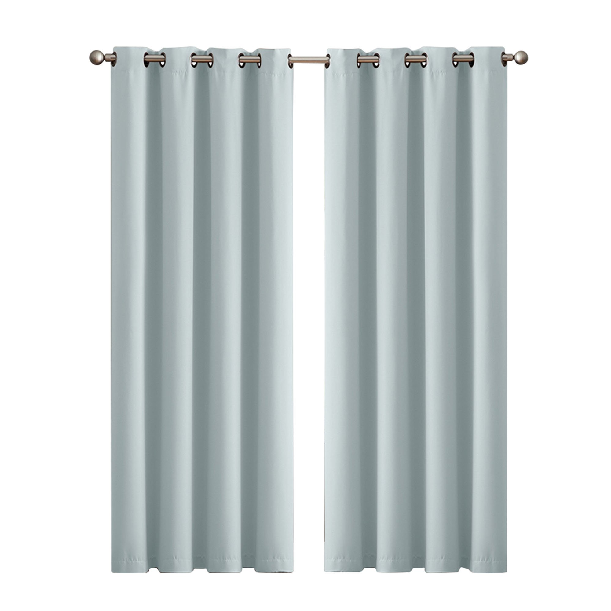 Two elegant blockout curtain panels in vibrant color, featuring eyelet design and triple weave fabric, hanging gracefully in a stylish room.