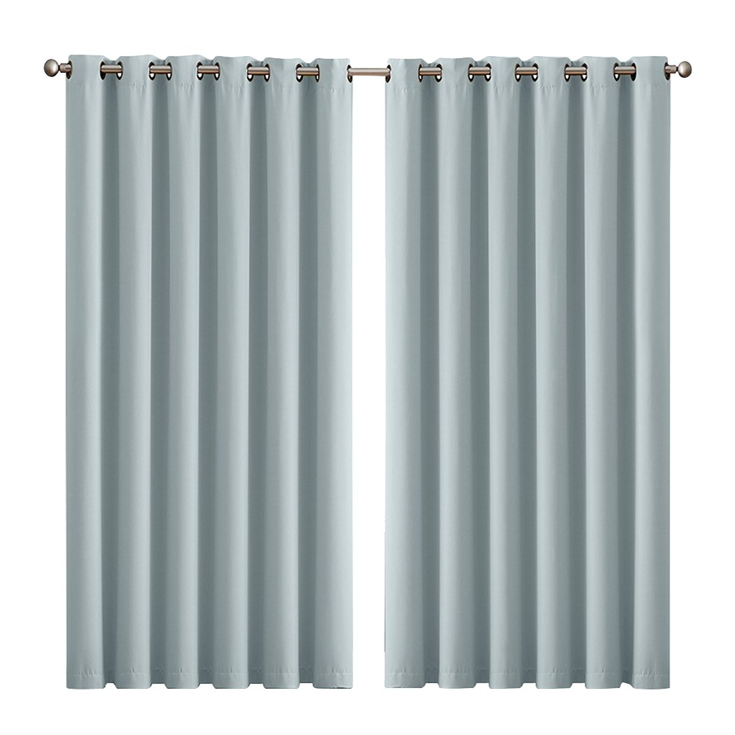 Two elegant blockout curtain panels in vibrant color, designed for room darkening and noise insulation, featuring eyelet design and triple weave fabric.
