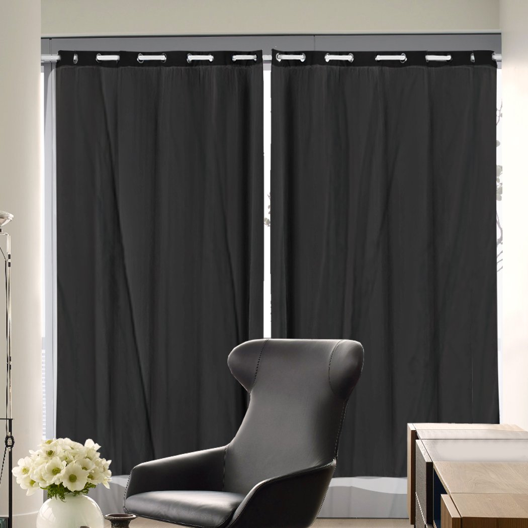 Two elegant blockout curtain panels with gauze, showcasing a rich texture and grommet top for easy hanging.