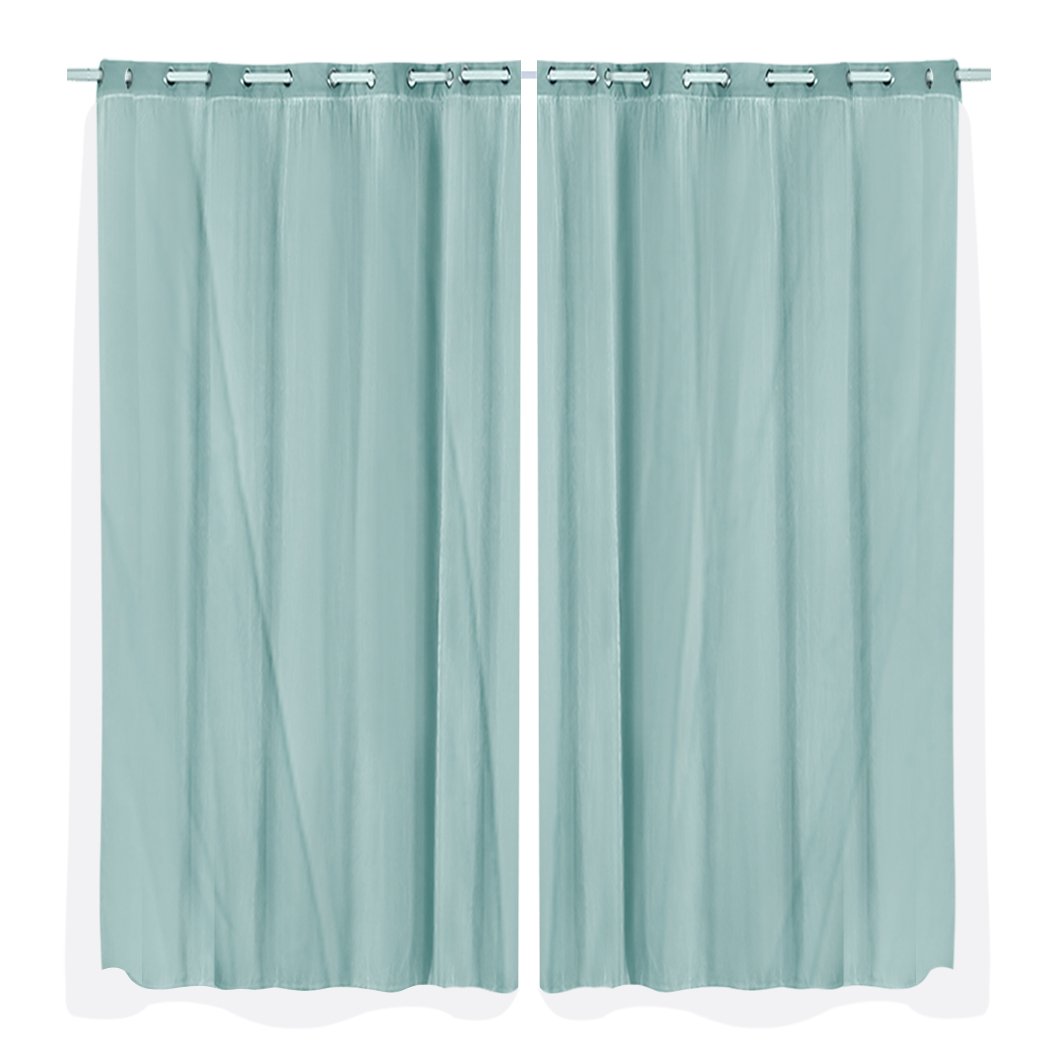 Two elegant blockout curtain panels with gauze, showcasing a stylish design and grommet top for easy hanging.