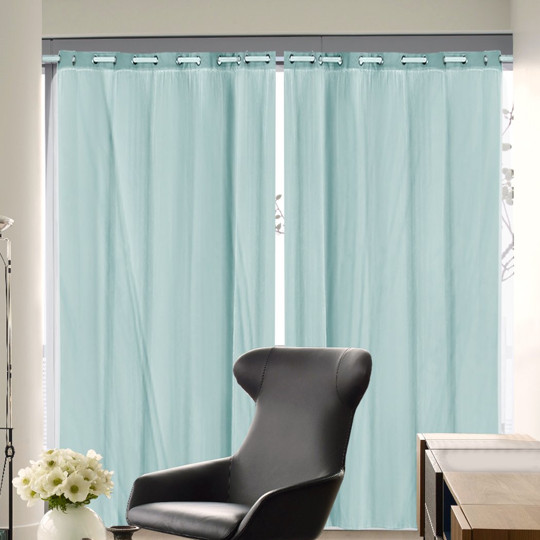 Two elegant blockout curtain panels with gauze, showcasing a stylish design and grommet top for easy hanging.