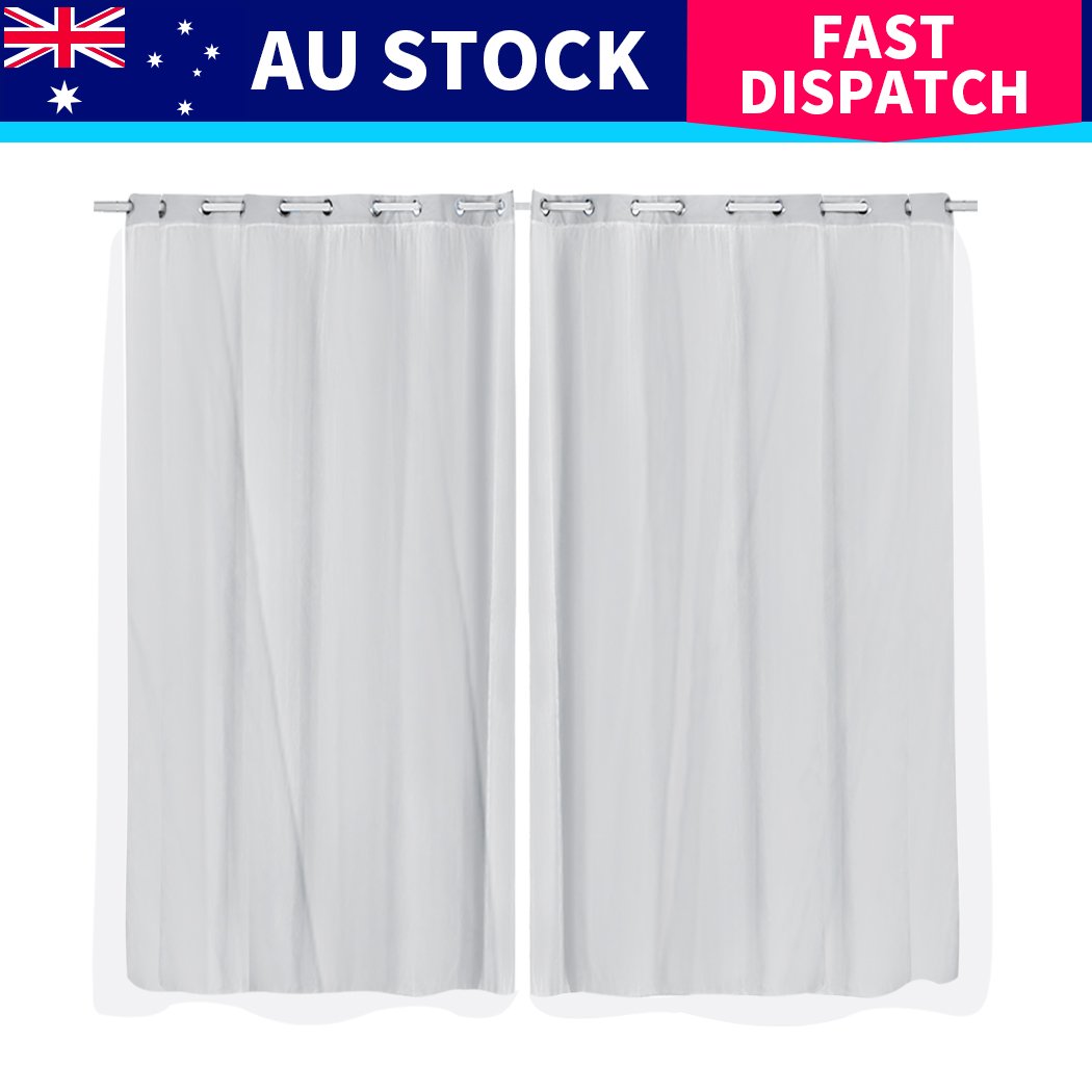 Two elegant blockout curtain panels with gauze, showcasing a rich texture and grommet top for easy hanging.