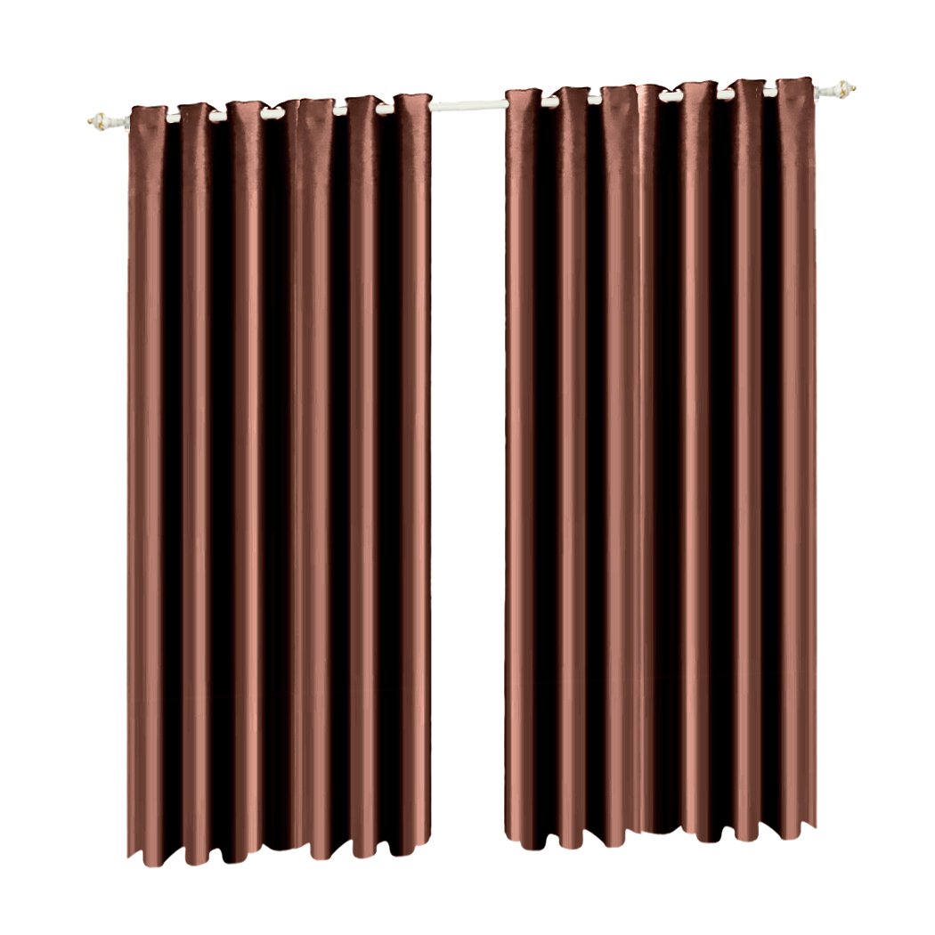 Two elegant blockout curtain panels in vibrant color, showcasing eyelet design and three-layer construction for effective room darkening.
