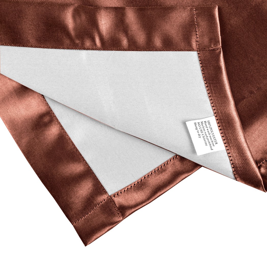 Two elegant blockout curtain panels in vibrant color, showcasing eyelet design and three-layer construction for effective room darkening.