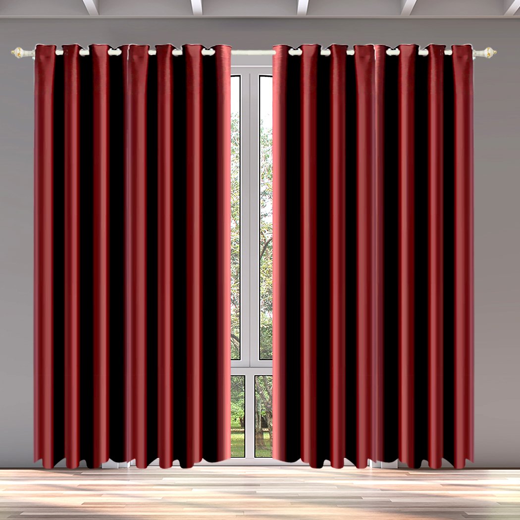 Two elegant blockout curtain panels in vibrant color, showcasing eyelet design and triple-layer construction for effective room darkening.