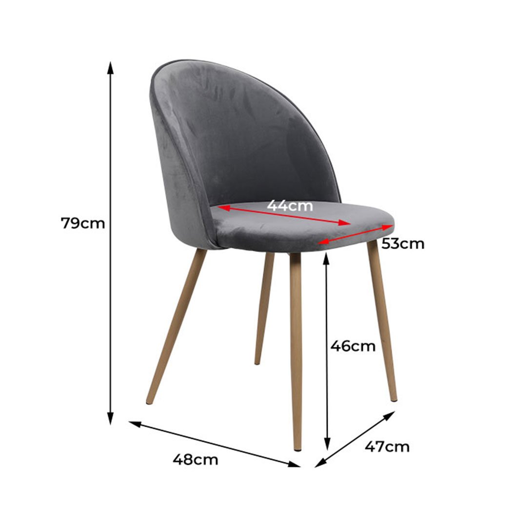 Two elegant grey velvet dining chairs with steel legs, showcasing a French Provincial design, perfect for kitchen or lounge areas.