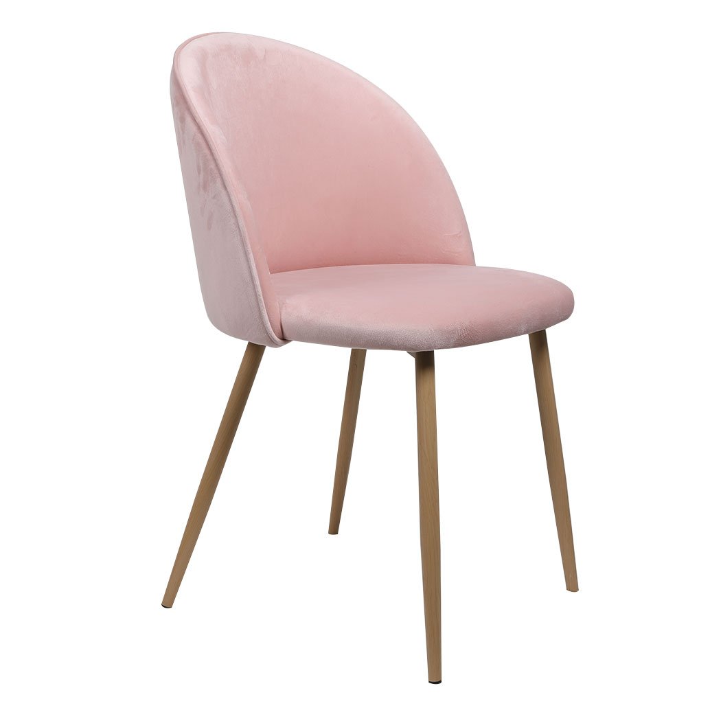 Two elegant pink velvet dining chairs with steel legs, showcasing French Provincial style, perfect for kitchen or lounge settings.