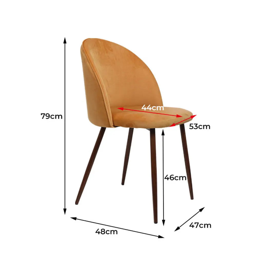 Set of two mustard dining chairs with plush velvet upholstery and sturdy steel legs, perfect for kitchen or lounge use.