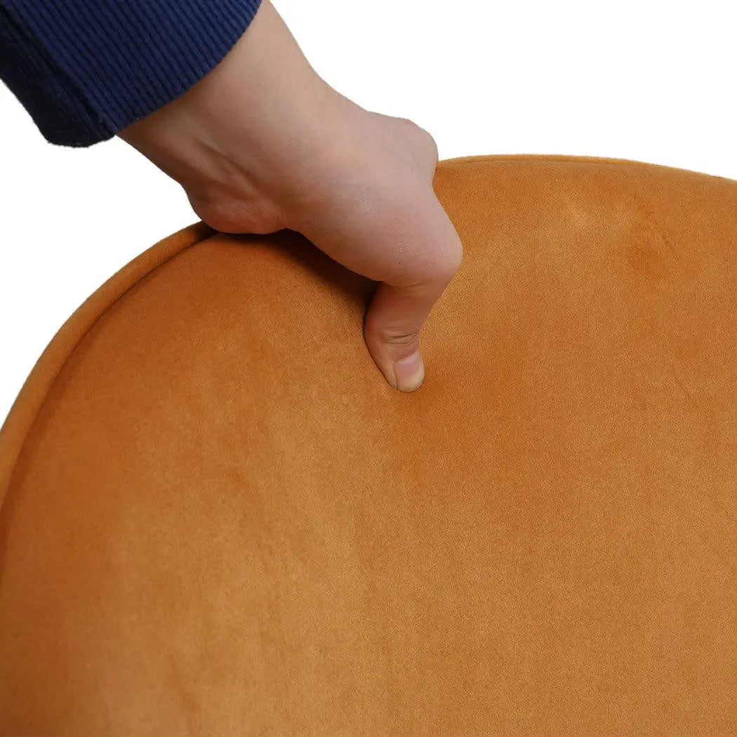 Set of two mustard dining chairs with plush velvet upholstery and sturdy steel legs, perfect for kitchen or lounge use.