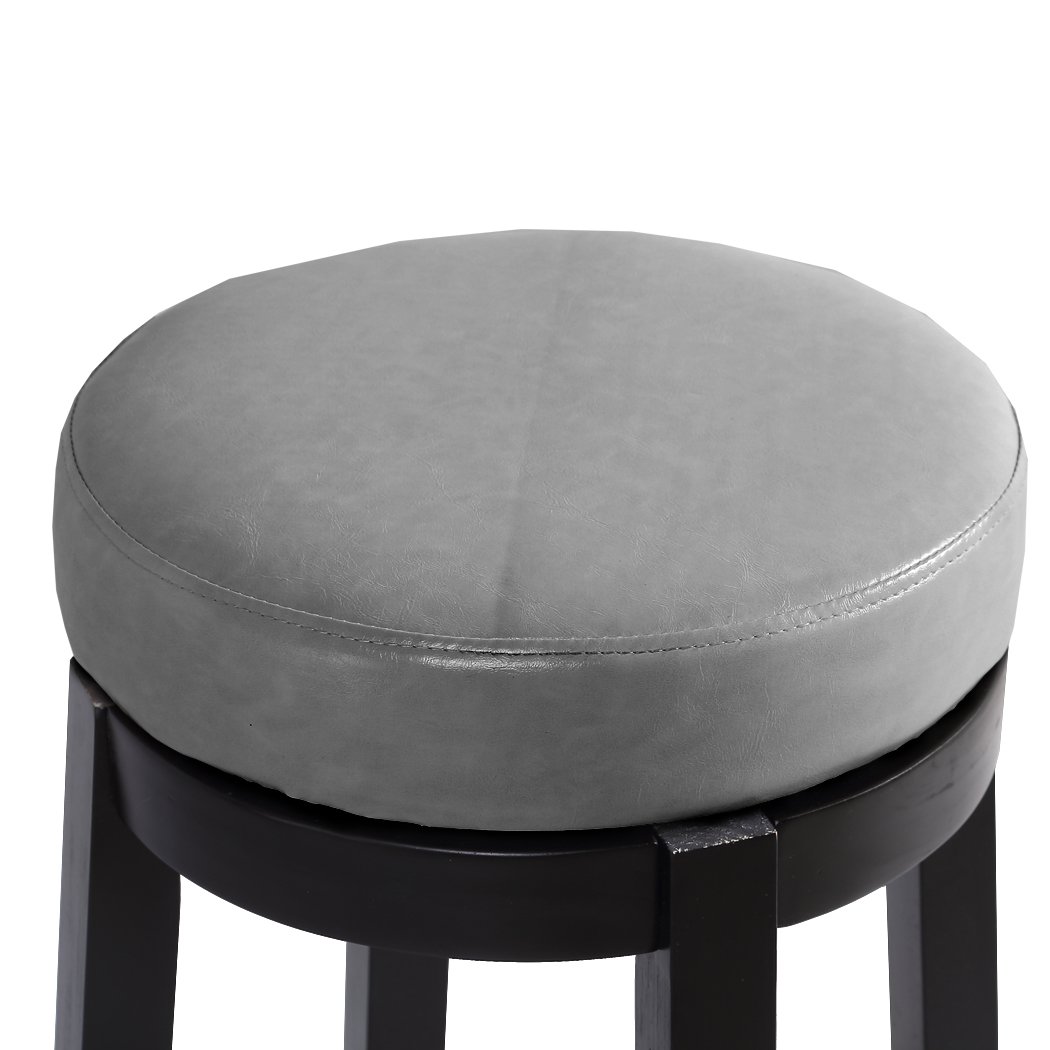 Two Levede 75cm swivel bar stools in dove grey with solid wood frame and PU leather upholstery, featuring a bronze-finished footrest.