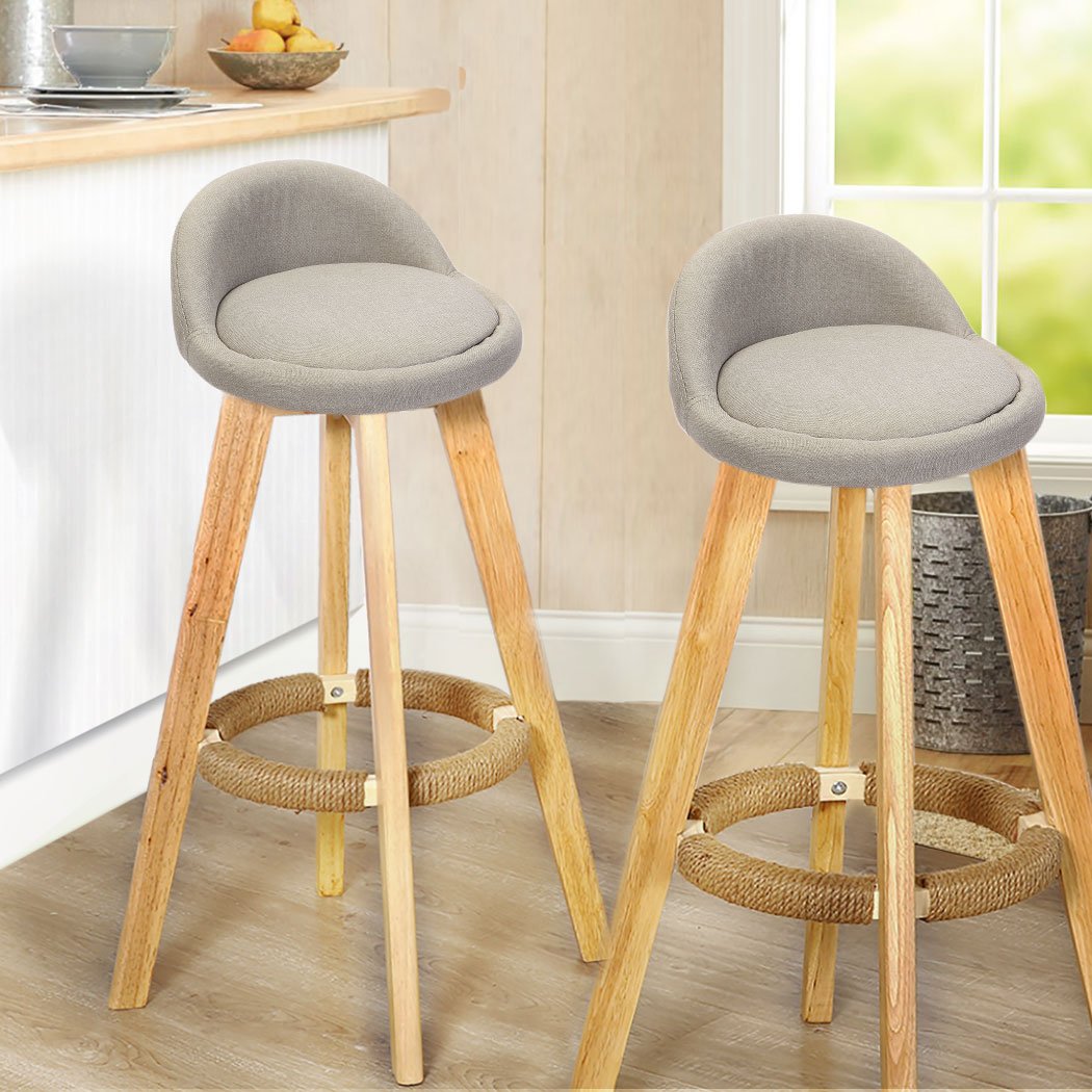 Two stylish Levede Fabric Swivel Bar Stools in sage color, showcasing their comfortable design and solid wood construction.