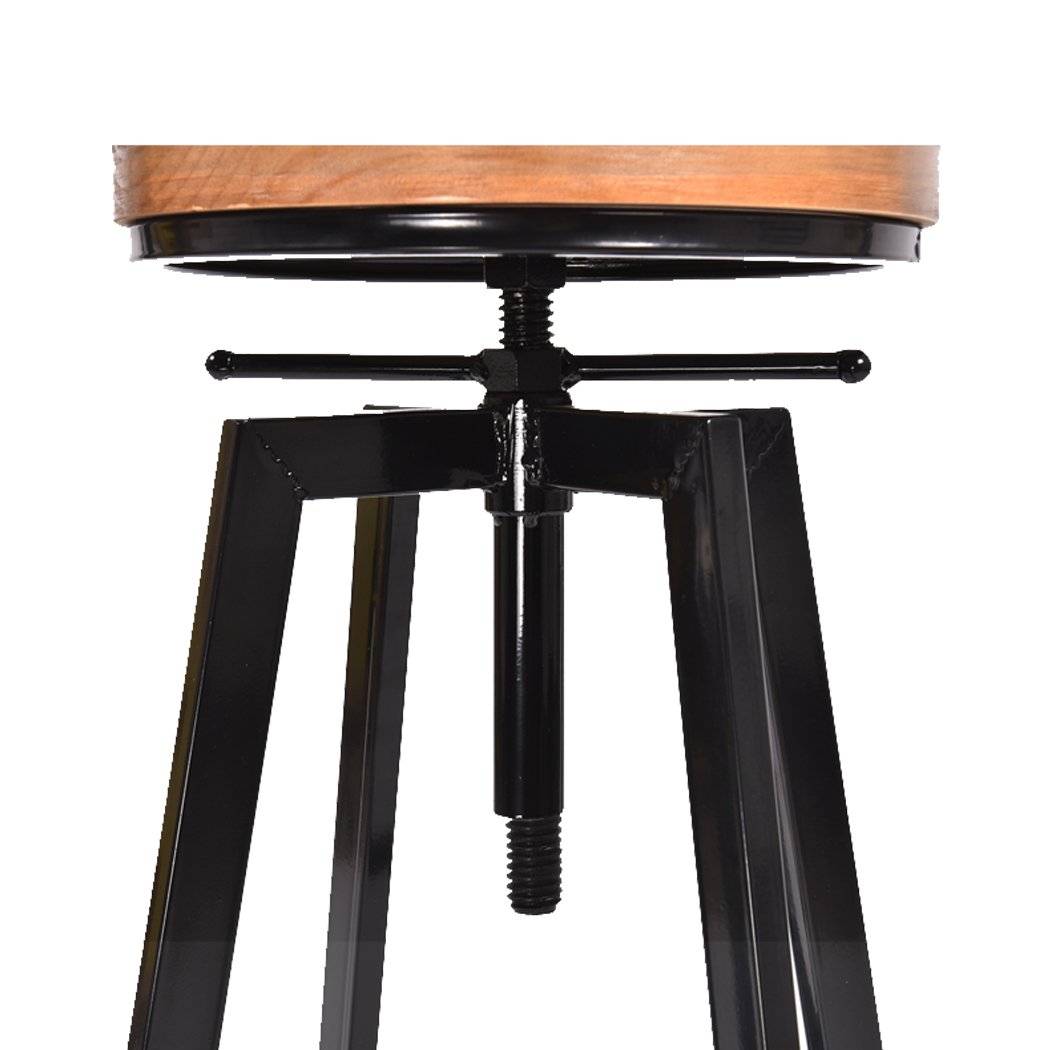 Two Levede Industrial Bar Stools with wooden seats and heavy-duty steel frames, showcasing a vintage industrial design.