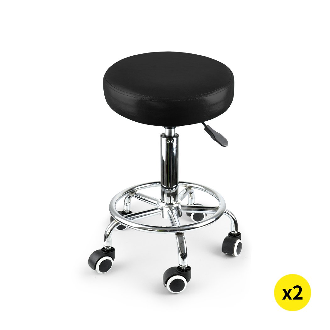 Two Levede Swivel Salon Barstools with black PU leather cushions and silver chromed iron bases, showcasing their 360-degree swivel and hydraulic lift features.