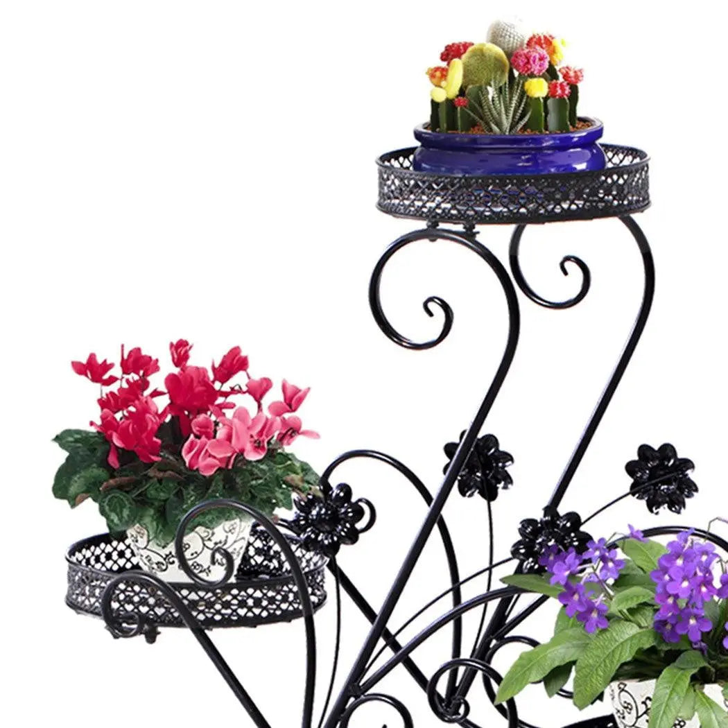Two elegant metal plant stands with imitation rattan design, showcasing vibrant plants, suitable for indoor and outdoor use.