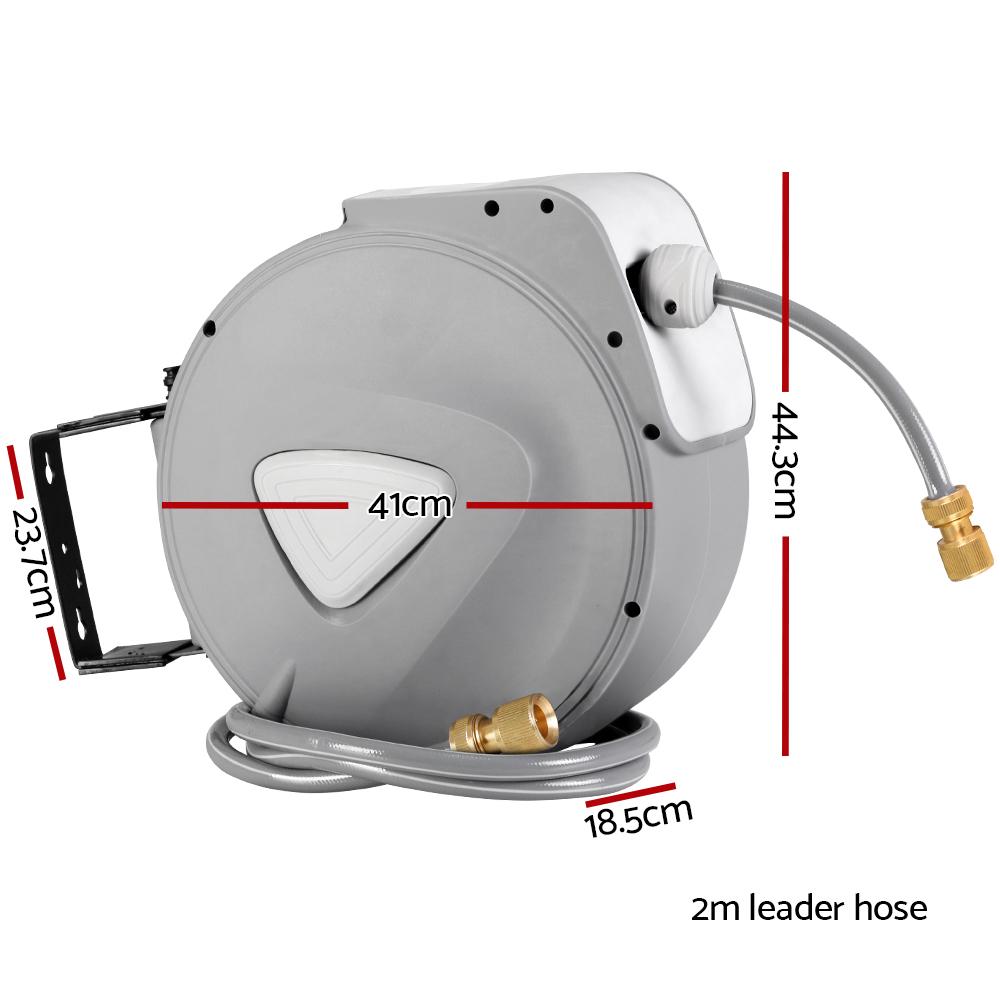 30M Retractable Hose Reel with brass spray gun, wall-mounted, grey finish, showcasing its compact and sturdy design.