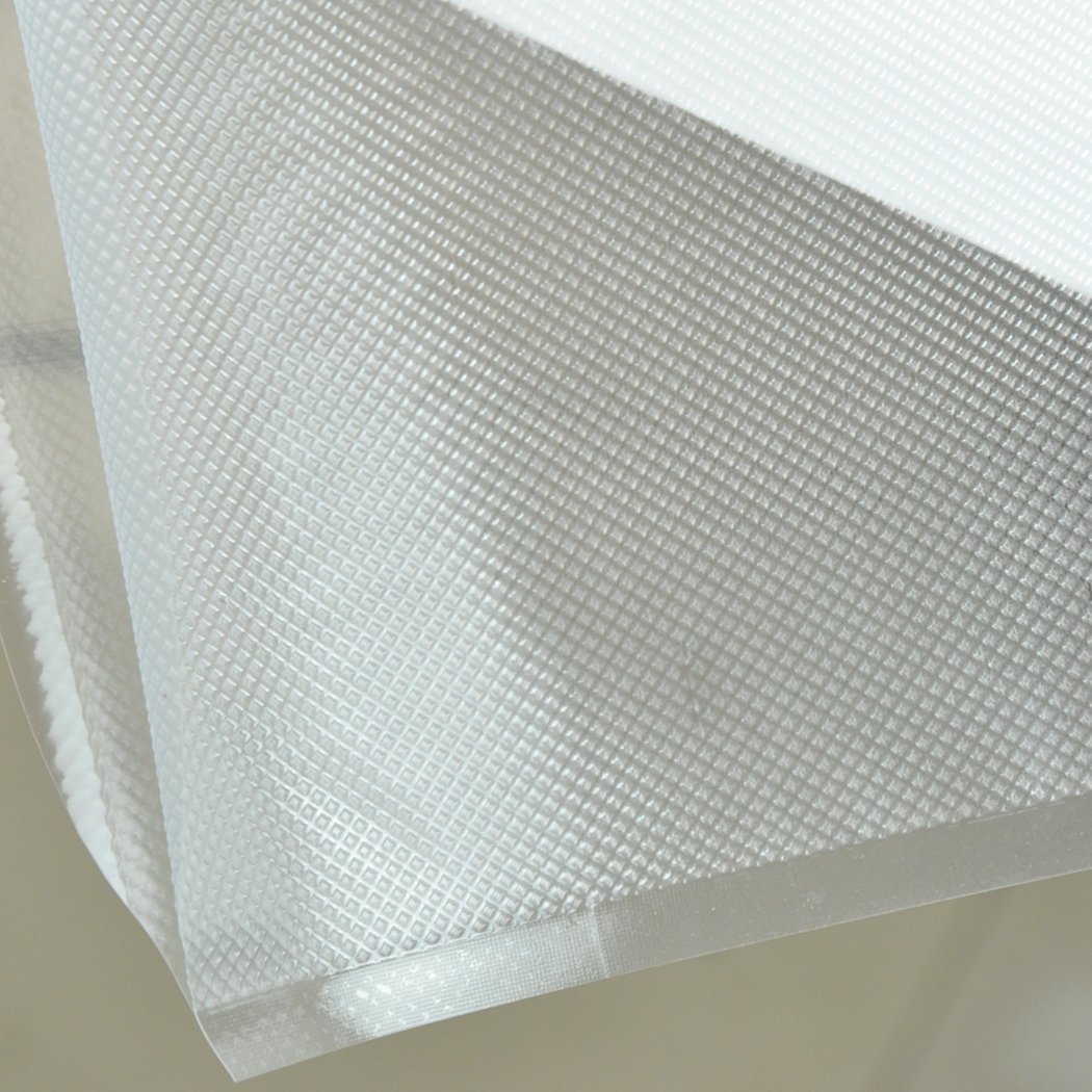 Four rolls of vacuum food sealer bags, clear and embossed, designed for food preservation and storage.