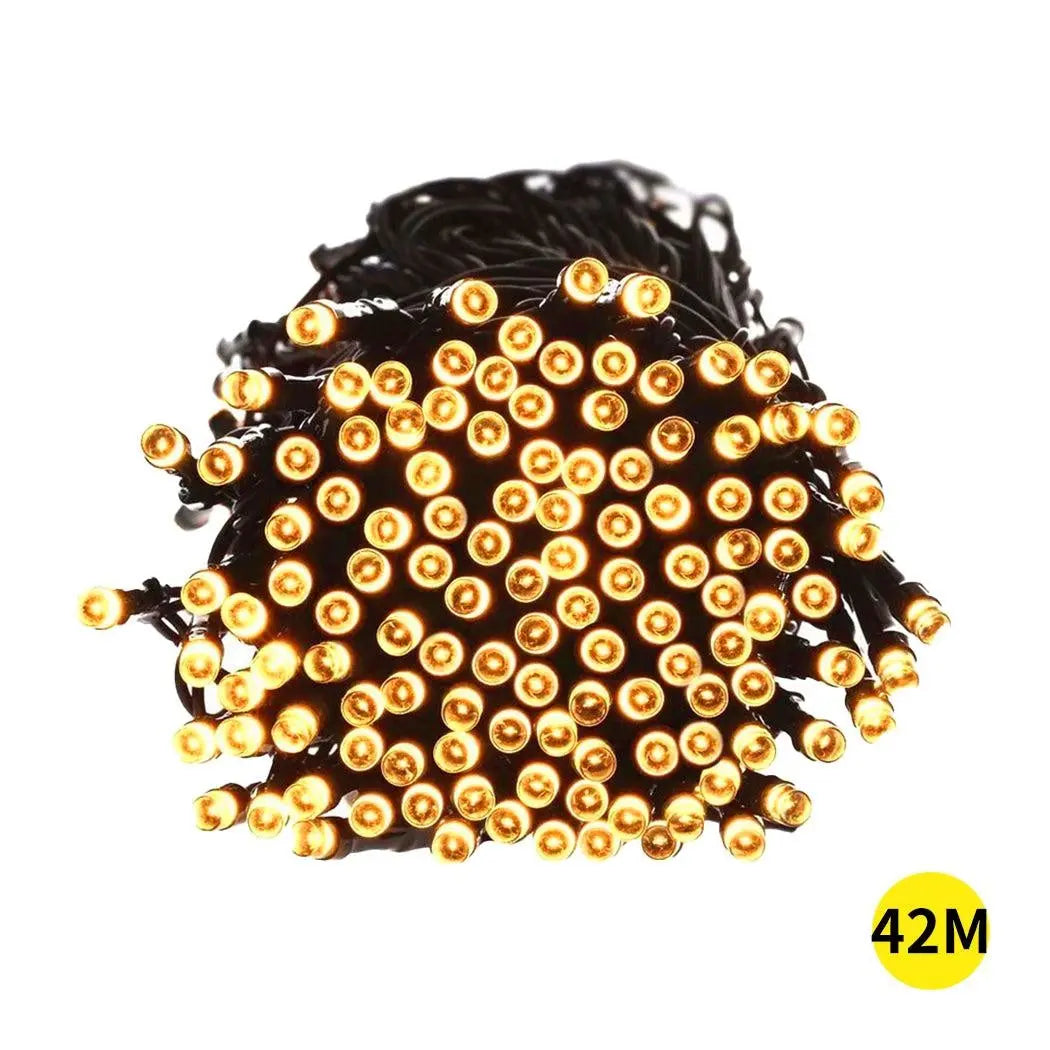 42M 400LED solar-powered fairy lights with warm white glow, perfect for garden and festive decor.