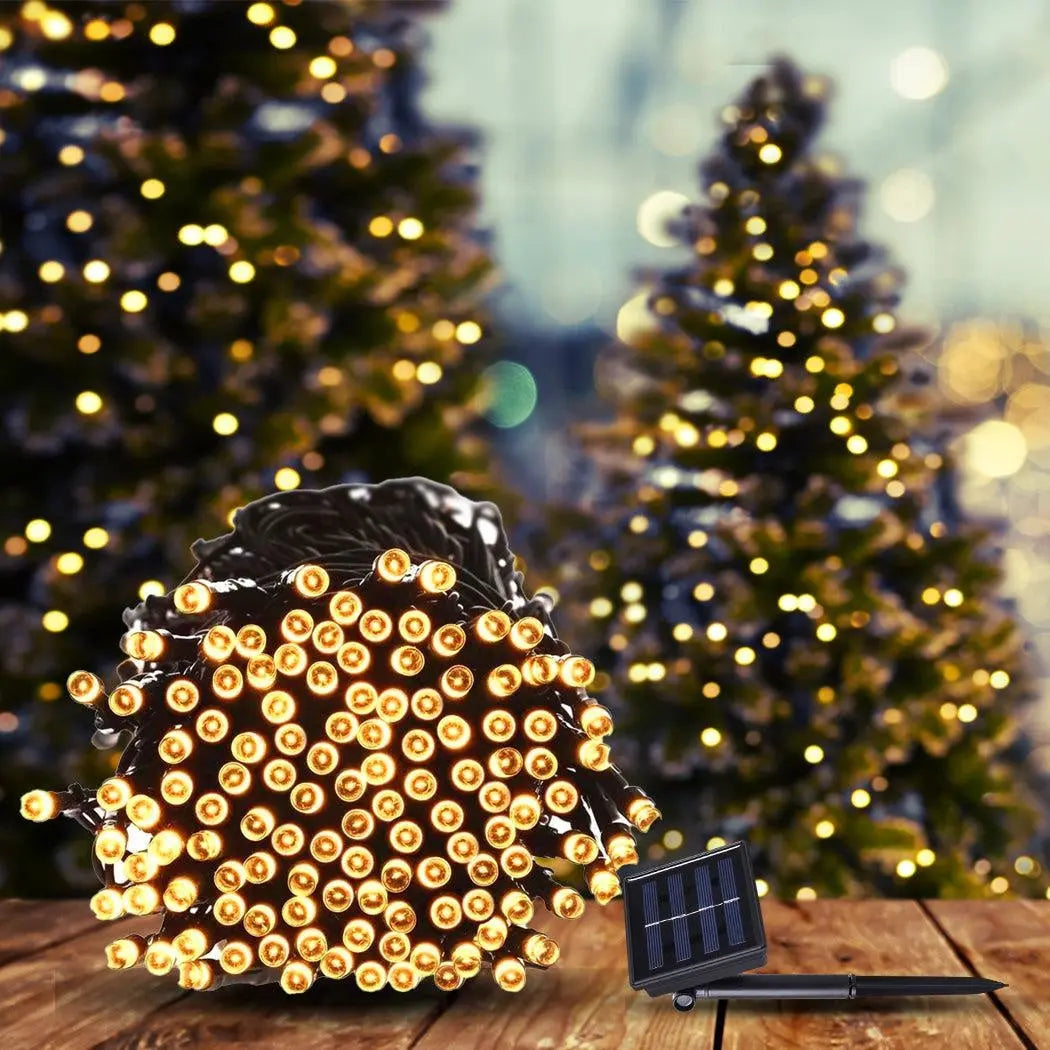 42M 400LED solar-powered fairy lights with warm white glow, perfect for garden and festive decor.
