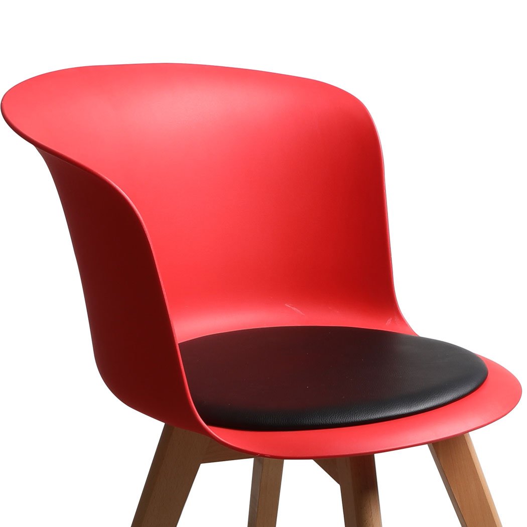 A stylish set of four office meeting chairs with PU leather seats in various colors, showcasing ergonomic design and sturdy beech wood legs.