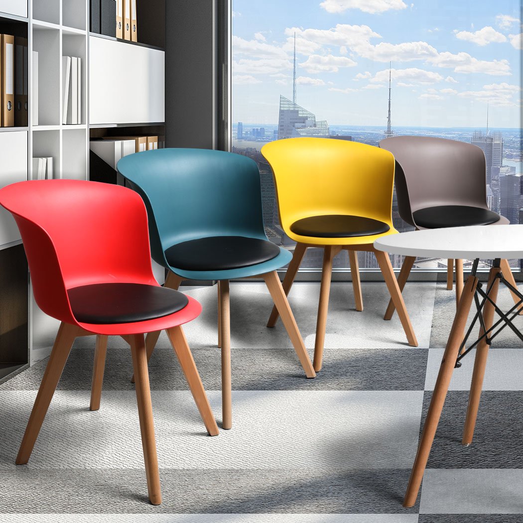 A stylish set of four office meeting chairs with PU leather seats in various colors, showcasing ergonomic design and sturdy beech wood legs.