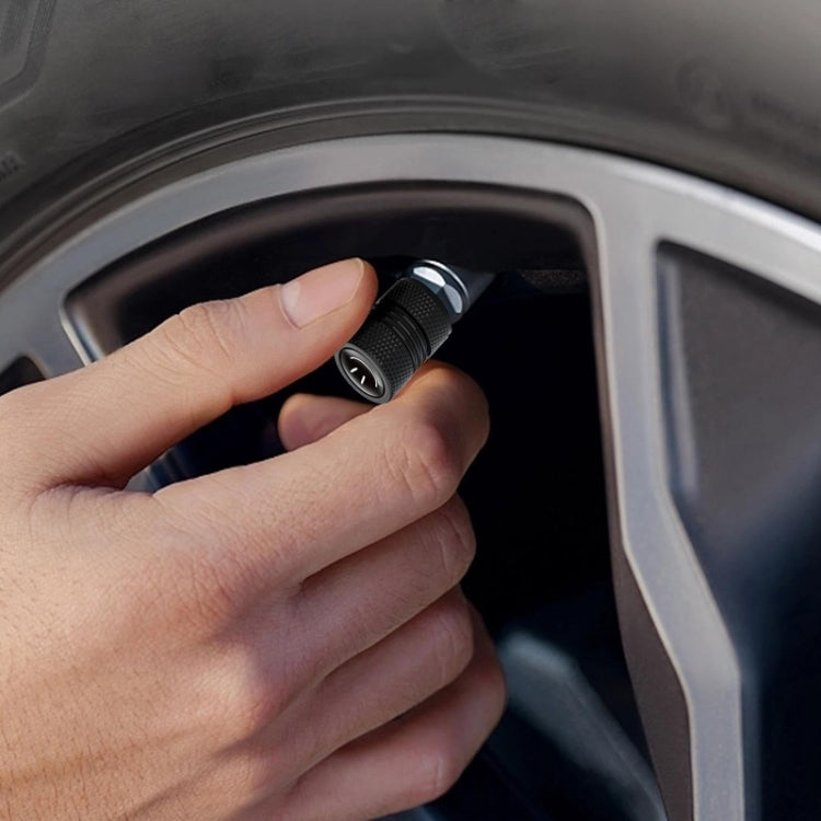 Set of four smiley face metal tire valve caps made from aluminum alloy, showcasing durability and style for automobiles.