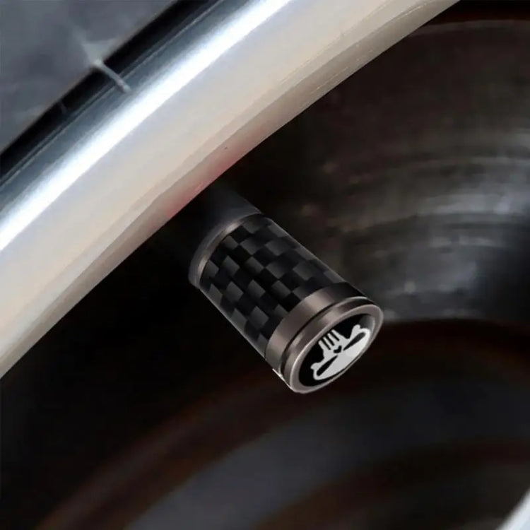 Set of 4 real carbon fibre skeleton tyre valve caps in black, showcasing their sleek design and durable material.