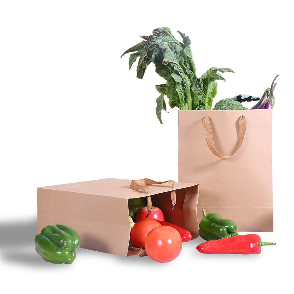 A stack of 50 eco-friendly brown paper bags with twisted handles, ideal for gifts and retail use.