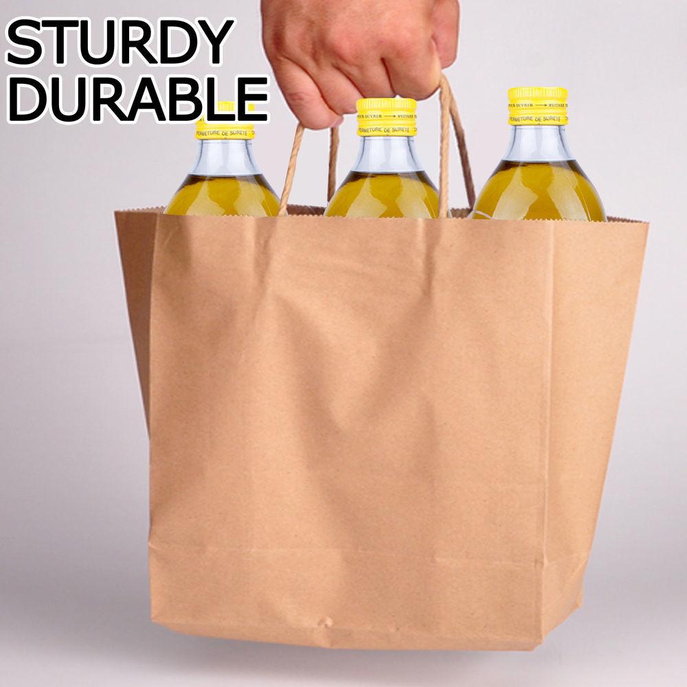 A stack of 50 eco-friendly brown paper bags with twisted handles, ideal for gifts and retail use.