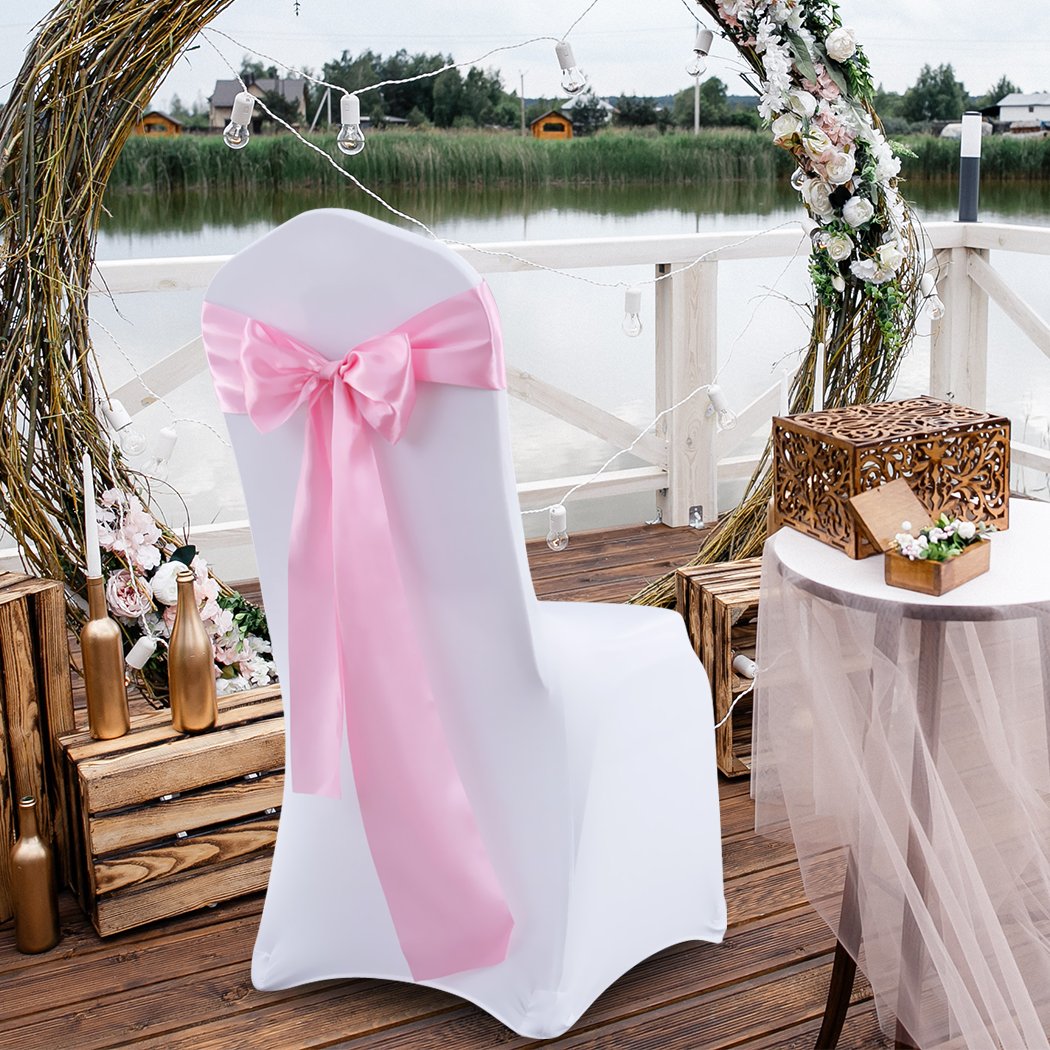 50 satin chair sashes in various colors elegantly draped over chairs, perfect for weddings and events.