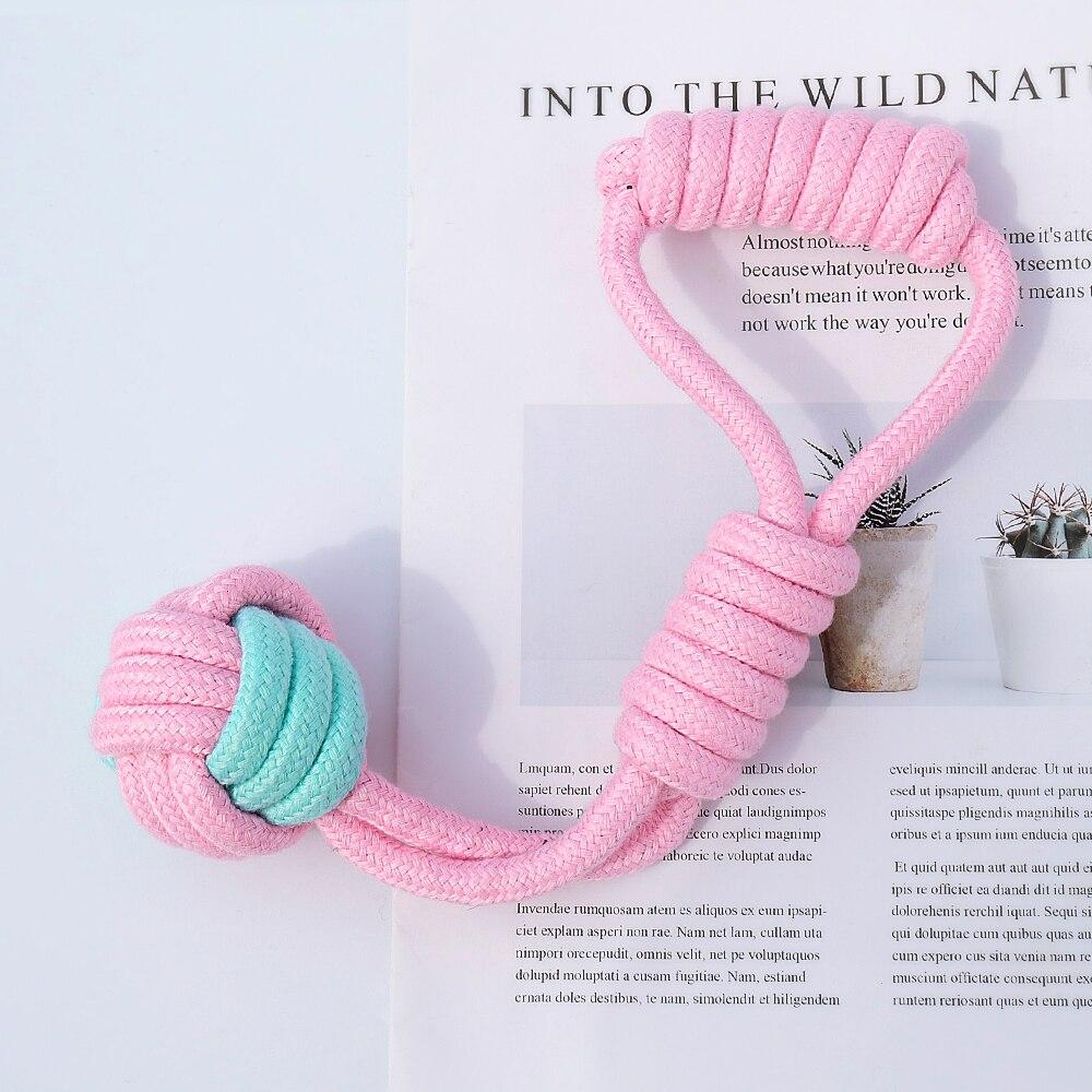 Five colorful cotton rope toys for dogs, designed for chewing and dental cleaning, featuring knots and a vibrant pink color.