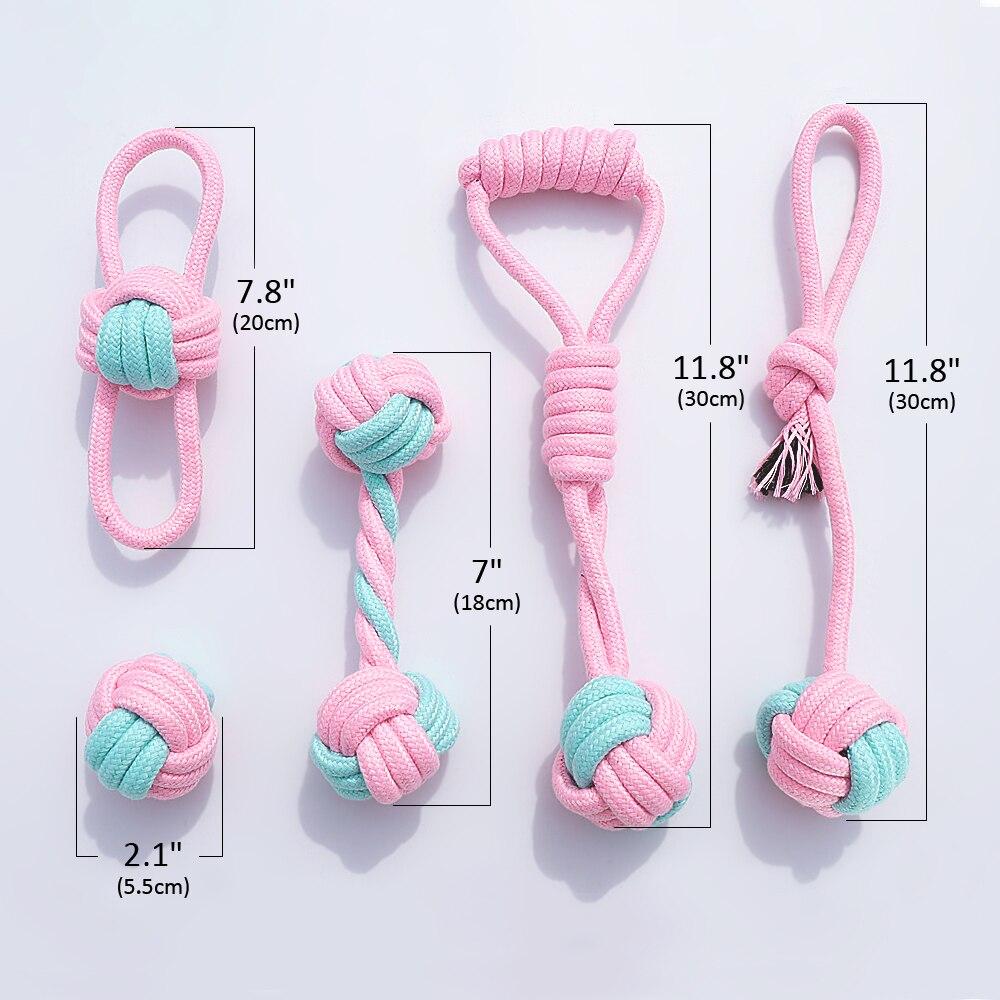 Five colorful cotton rope toys for dogs, designed for chewing and dental cleaning, featuring knots and a vibrant pink color.