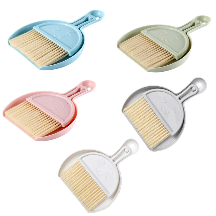 A green mini keyboard cleaning brush set with dustpan, featuring nylon bristles and a compact design for efficient cleaning.